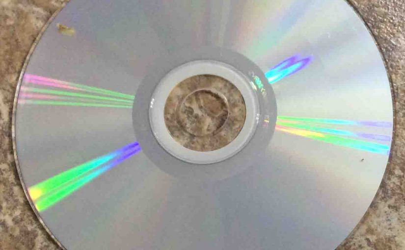 Picture of a lightly soiled CD music disc, showing the play side.