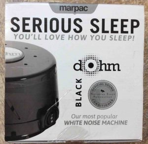 Picture of the Marpac Serious Sleep SS white noise machine, black version, original box top.
