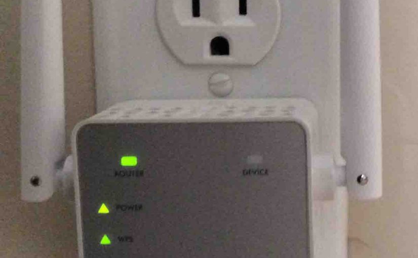 Picture of the Netgear® AC750 EX3700 WiFi range extender, connected and operating normally, showing green front lights.