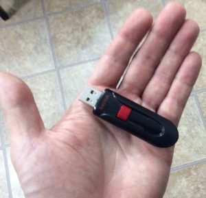 Picture of the drive held in hand to show its relative size.