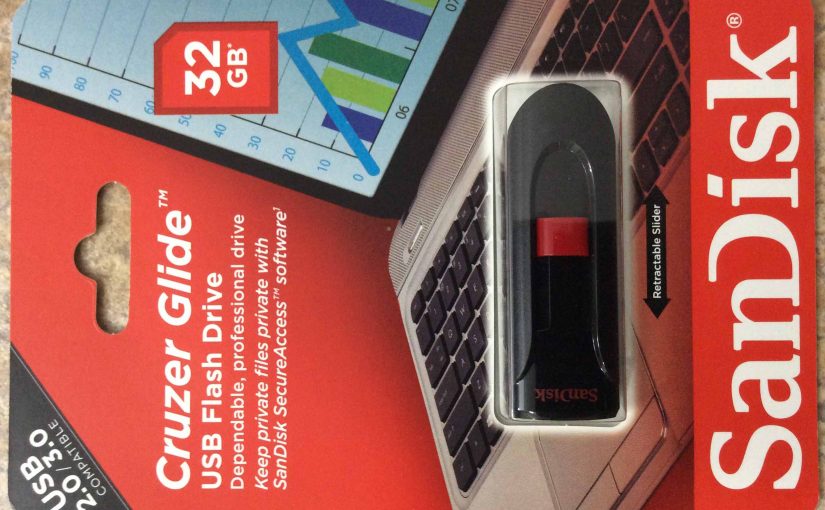 Picture of the Sandisk® Cruzer Glide™ USB thumb drive, 32 GB, original package front view, shown sideways.