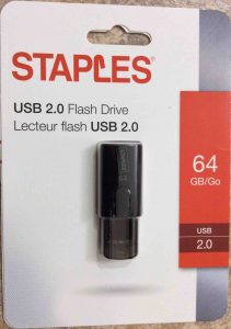 Picture of the Staples USB 2.0 stick drive, 64 GB, front view of original package.