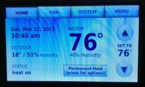 Picture of the Honeywell 9000 series color touchscreen thermostat, displaying its -Ice- color theme. 