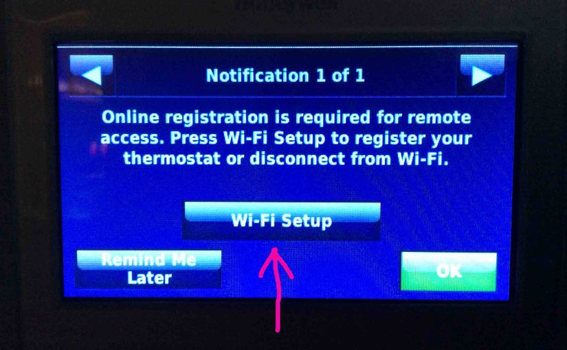 Honeywell RTH9580WF Wi-Fi thermostat, displaying a Notification screen, showing that a registration is needed, with the -Wi-Fi Setup- button highlighted.