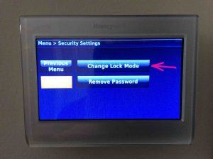 Picture of the smart thermostat, displaying its -Security Settings- screen, showing the -Remove Password- button with the -Change Lock Mode- button highlighted.