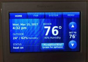 Picture of the Honeywell RTH9580WF thermostat, displaying its -Home- screen, after new temperature offset applied.
