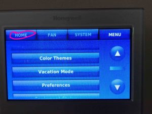 Picture of the -Main Menu- page on the Honeywell thermostat, with the -Home- button highlighted.