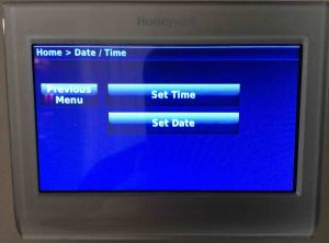 Picture of the Honeywell RTH9580WF Wi-Fi thermostat, displaying its -Date/Time- screen.