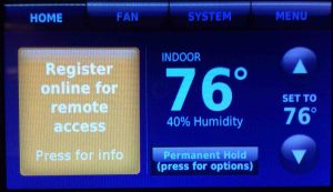 Picture of the Honeywell RTH9580WF Wi-Fi thermostat, displaying the -Register Thermostat Online- message. Unregister Honeywell Thermostat RTH9580WF.