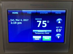 Picture of the Honeywell RTH9580WF wireless thermostat, displaying its -Hold Switch- screen, with -Permanent Hold- selected.