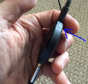 Picture of the Google Chromecast Audio receiver, side view, showing the reset button highlighted.