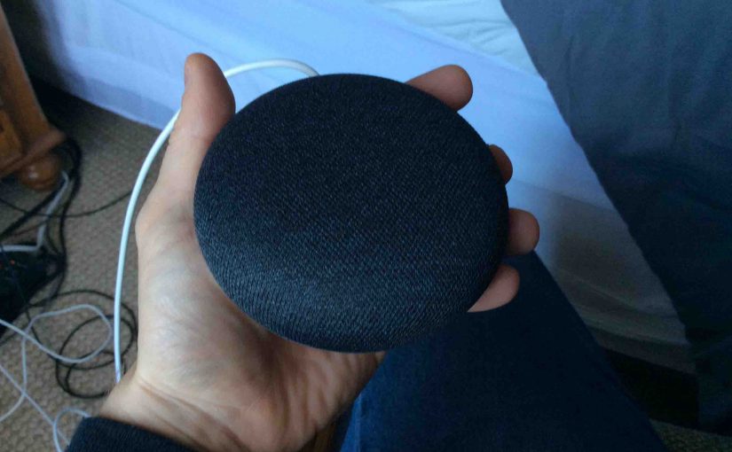 Picture of the Google Home Mini speaker, lights dark after reset, prior to reboot.