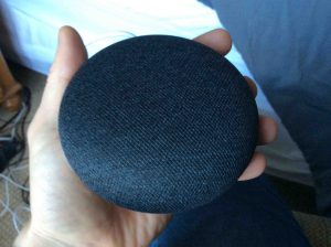 Picture of the Google Mini smart speaker. Its lights are dark during reset or when powered off.