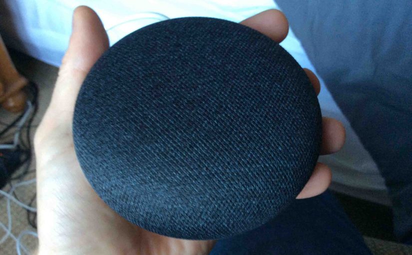 Picture of the Google Home Mini smart speaker, lights dark during reset or when powered off.
