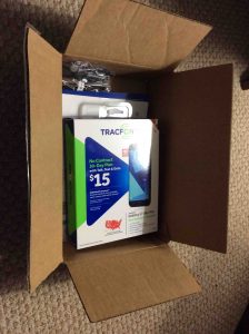 Picture of the Samsung Galaxy J7 Sky Pro TracFone in open, original shipping box.