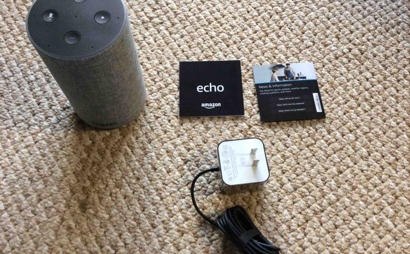 Picture of the Amazon second generation echo speaker with sll accompanying accessories unboxed.