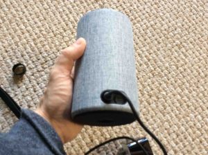 Picture of the Amazon Echo 2nd gen speaker, rear view, with its DC power plug inserted.