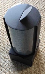 Picture of the Amazon Echo 2nd generation speaker, unit holder removed from box.