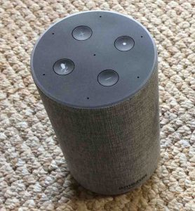 Picture of the Amazon Echo 2nd generation Alexa speaker, top view, showing the light ring and the volume, mic mute, and action buttons. 