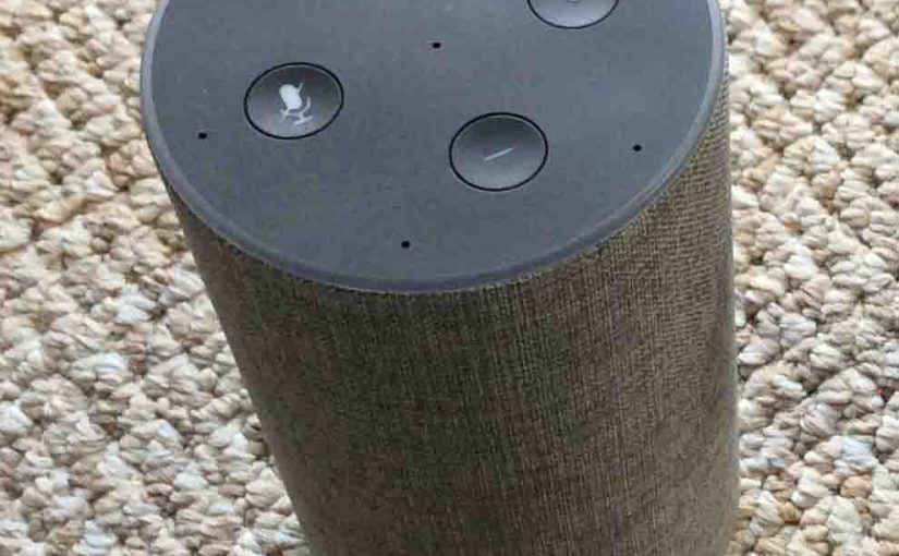 Picture of the Amazon Echo 2nd generation Alexa speaker, top view, showing the light ring and the volume, mic mute, and action buttons.