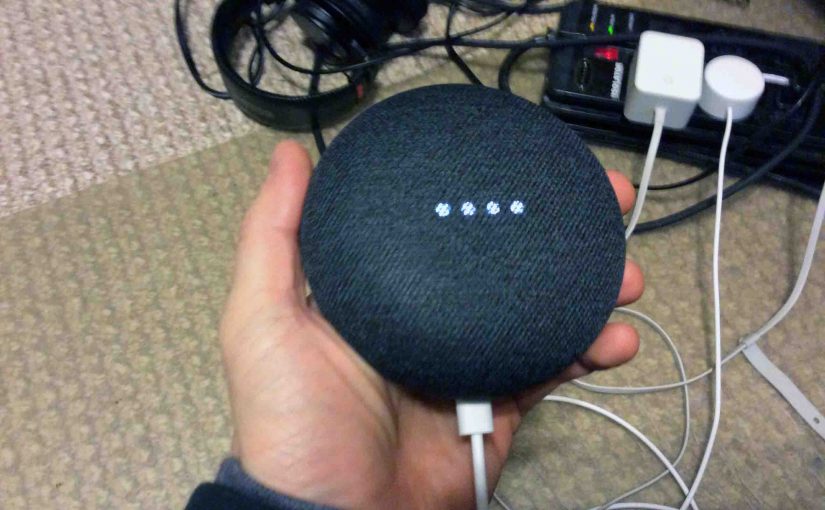 Picture of the Google Home Mini smart speaker, powered up, and ready for setup.
