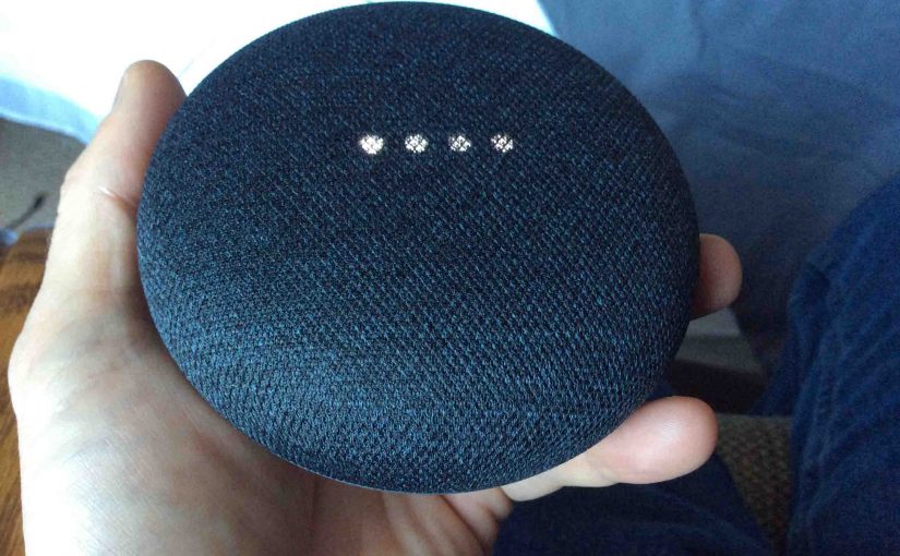 Picture of the Google Home Mini speaker rebooting, showing white scanning lights pattern.