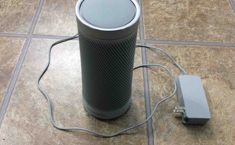 Picture of the Microsoft Invoke Cortana smart speaker, with its AC adapter unplugged from wall and powered off, prior to rebooting.