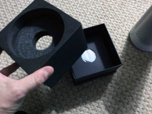 Picture of the Microsoft Invoke speaker, original box bottom, with pedestal part removed.