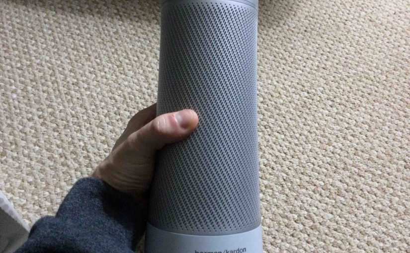 Picture of the Microsoft Invoke voice activated speaker, front view, unboxed, held In hand.