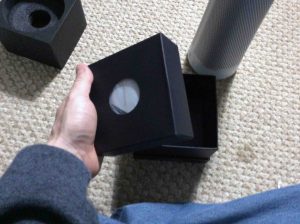 Picture of the Harman Kardon Invoke speaker inner accessories box, removed from outer box bottom.