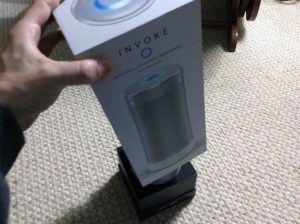 Picture of the Harman Kardon Invoke voice activated speaker, new in box, with the sealing tape removed.