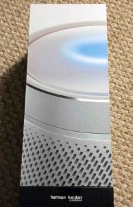 Picture of the Harman Kardon Invoke speaker, side view, new in box, outer plastic removed.