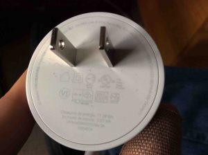 Picture of the USB power adapter for the Google Home Mini smart speaker, AC prongs side view, showing specs.