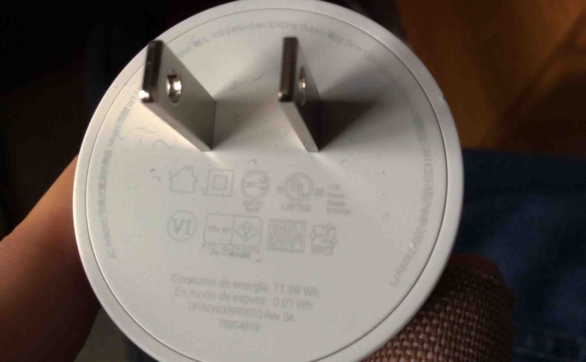Picture of the USB power adapter for the Google Home Mini smart speaker, AC prongs side view, showing specs.