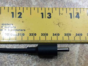 Picture of the adapter DC output barrel connector against a ruler.