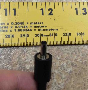 Picture of the DC output barrel connector, top view, against a ruler.