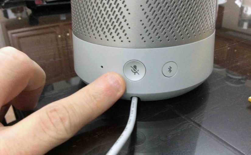Picture of the reset button on the back of the Harman Kardon Invoke voice activated smart speaker.