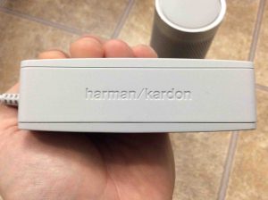 Picture of the Harman Kardon Microsoft Invoke smart speaker AC power adapter, showing the logo side.