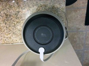 Picture of the speaker, bottom view, showing the DC supply cord connected.