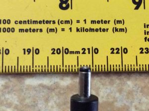 Picture of the BI Model 13-05020-0BDU AC power adapter DC output connector. showing its width against a ruler.