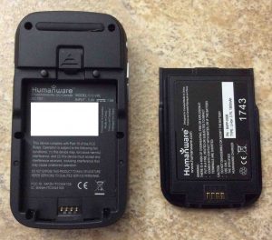 Picture of the Victor Reader Trek audio book player, back view, showing the rechargeable battery removed, along with writing on both battery, and inside the battery compartment.