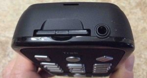 Picture of the HumanWare Victor Reader Trek talking book player and GPS navigator, top view, showing the SD card slot and headphone / external microphone port.