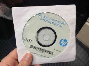 Picture of the HP Color Laserjet M477 driver software disc.