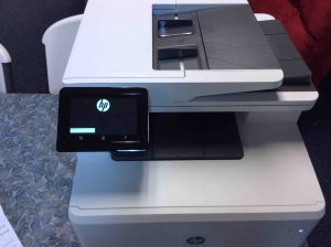 Picture of the Laserjet Pro MFP printer, showing its control panel screen during booting.