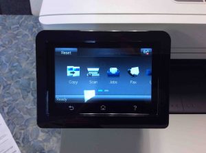 Picture of the M477 printer, displaying its -Home- screen, with WiFi not connected.