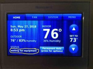 Picture of the Honeywell RTH9580WF thermostat, displaying its -Waiting for Equipment- message, highlighted.