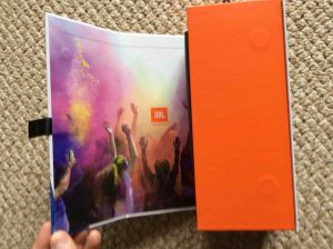 Picture of the JBL Flip 4 portable speaker, original box, opening outer flap. JBL Flip 4 portable Bluetooth speaker picture gallery.