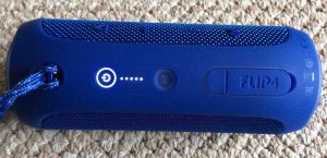 Picture of the JBL Bluetooth speaker, top view, powered ON.