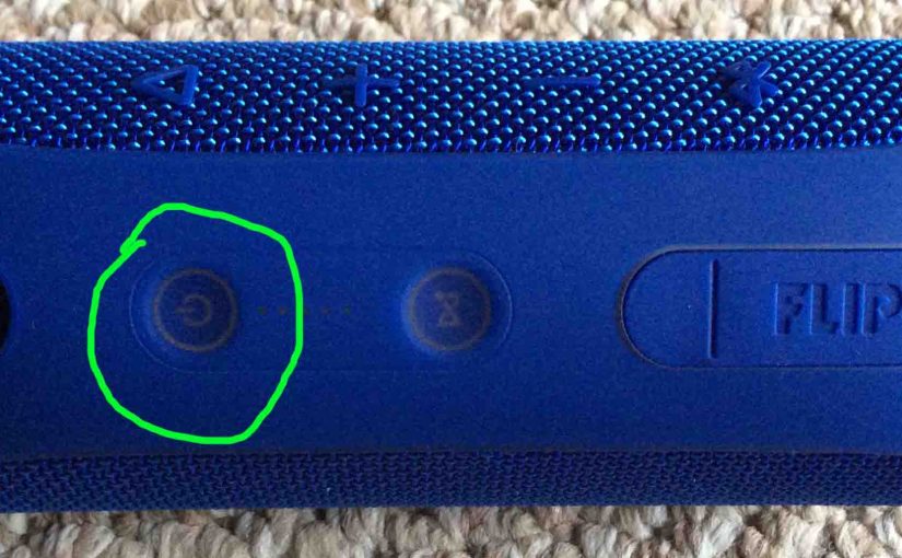 Picture of the JBL Flip 4 speaker turned OFF, with its Power button circled.