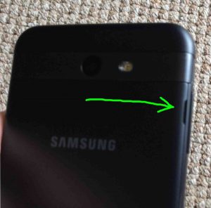 Showing the phone back cover with its release to open slot highlighted. Samsung Galaxy J7 Picture Gallery.
